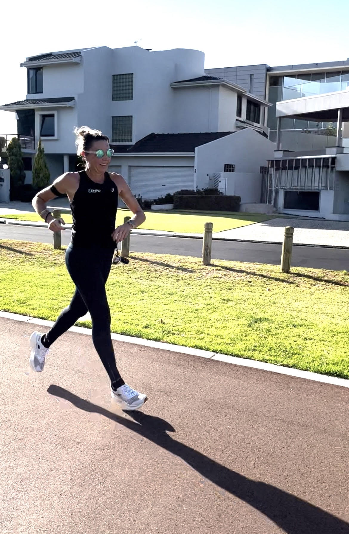 Amanda running wearing 2nu performance sunglasses