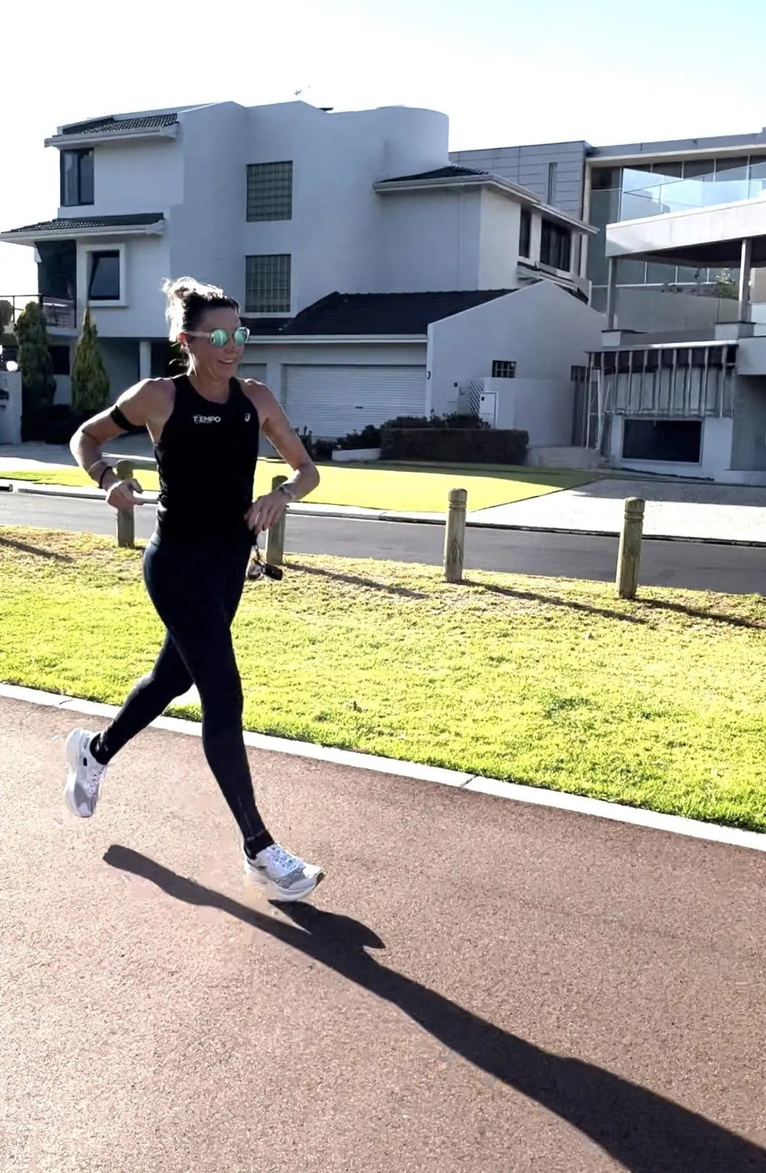 Amanda running wearing 2nu performance sunglasses