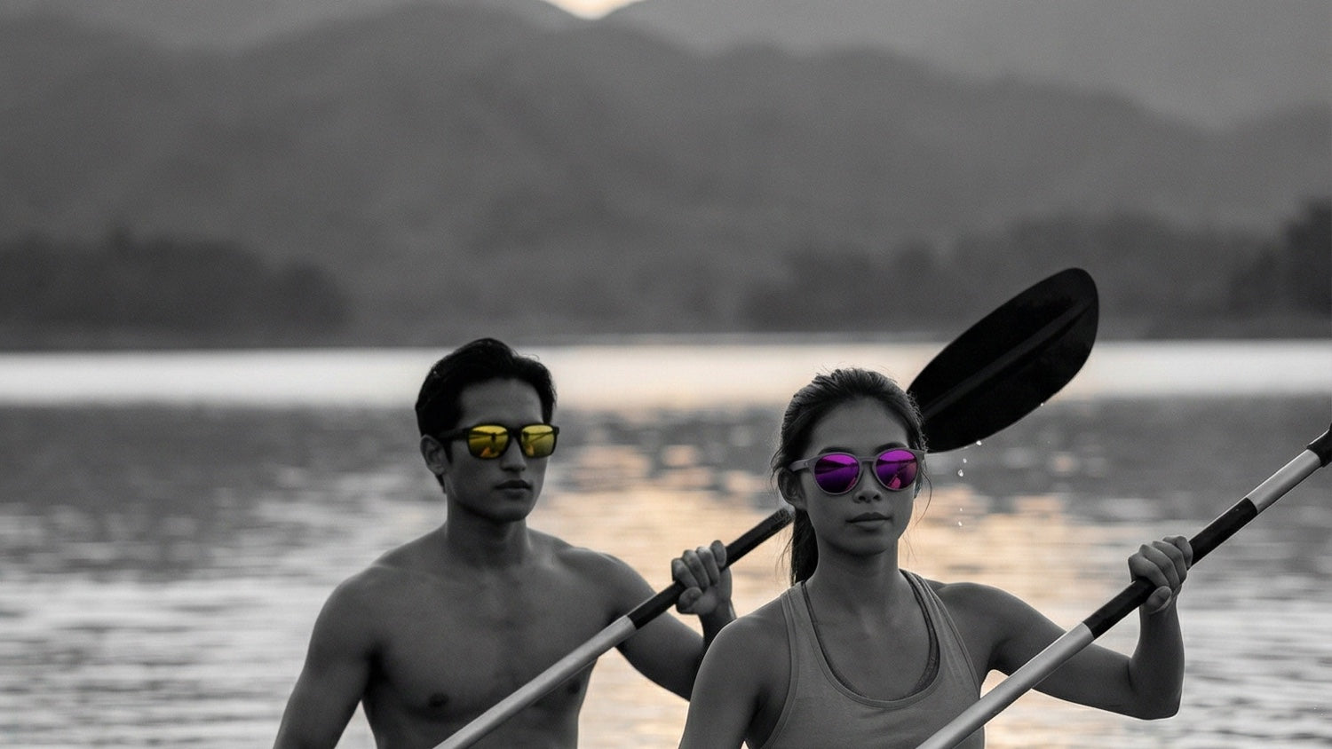 Asian paddlers wearing performance sunglasses on reflective water