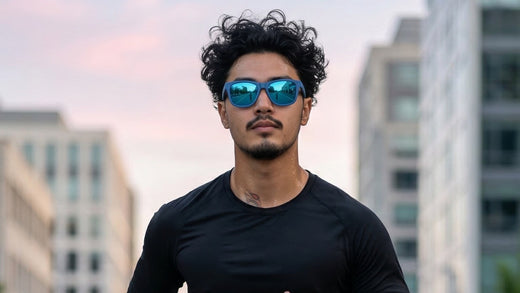 Urban runner wearing performance sunglasses with visible perspiration during a humid outdoor run